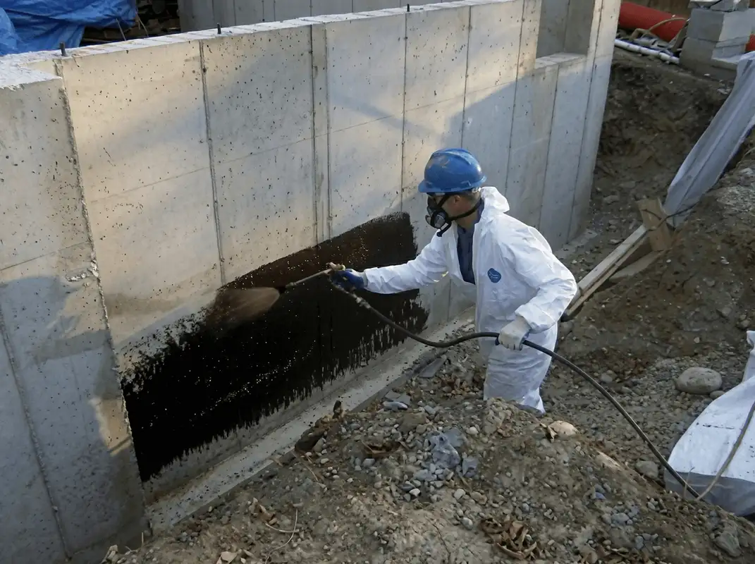 Professional waterproofing the exterior walls of the basement in Richmond, VA