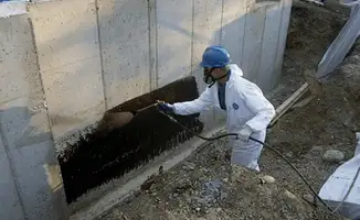 Professional waterproofing the exterior walls of the basement in Richmond, VA