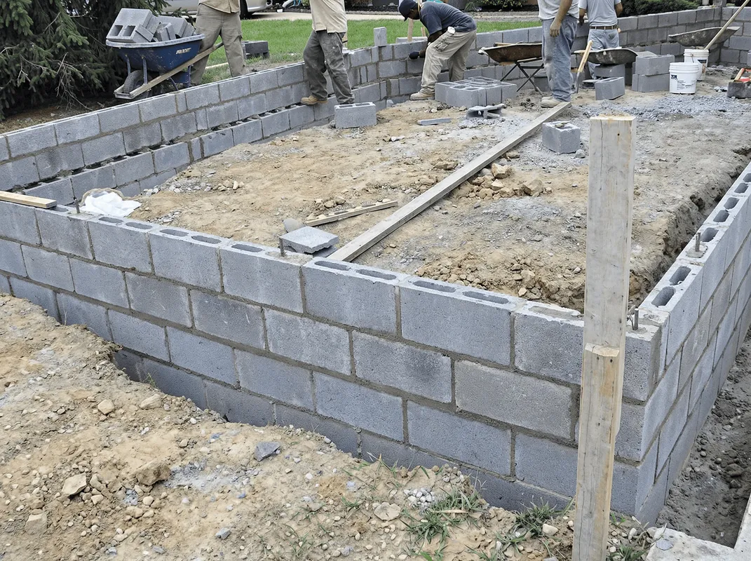 Professionals building a foundation with blocks in Richmond, VA