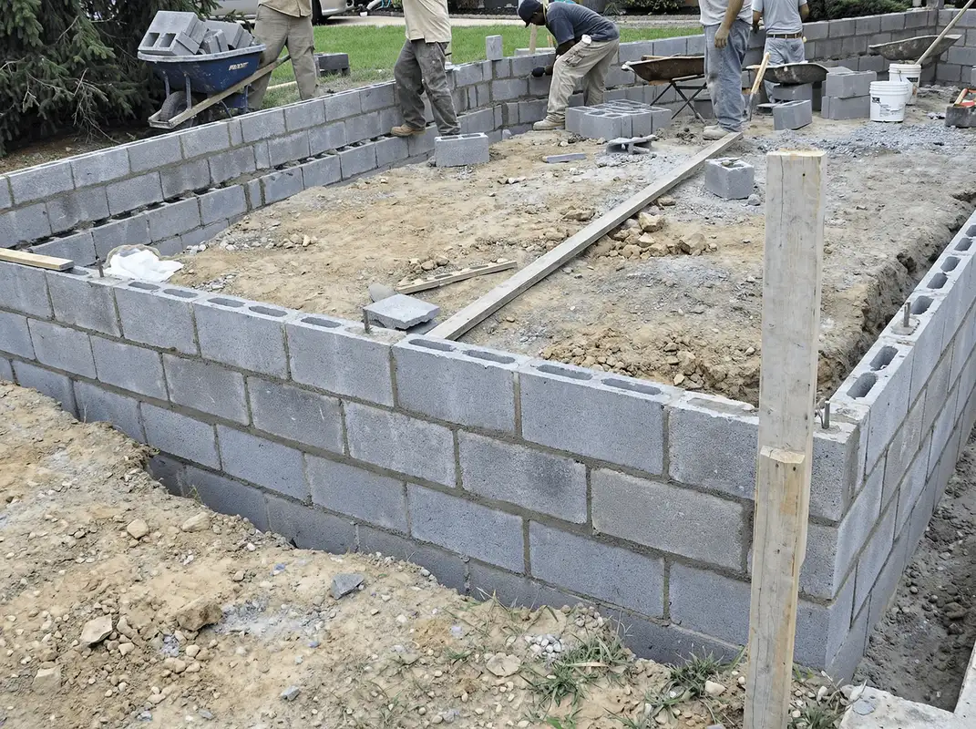 Professionals building a foundation with blocks in Richmond, VA