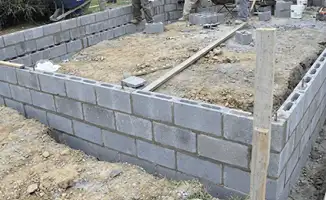 Professionals building a foundation with blocks in Richmond, VA