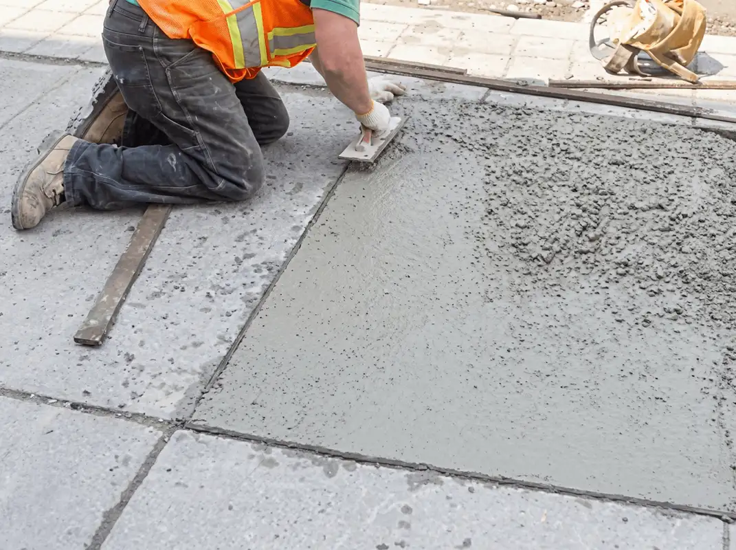 Professional repairing a concrete floor in Richmond, VA