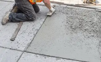 Professional repairing a concrete floor in Richmond, VA